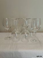 Front view of seven wine glasses standing and inverted