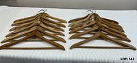 Grouped view of wooden suit hangers