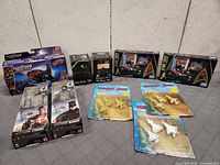 Group shot of all 11 sealed toy items