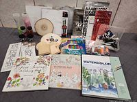 Assorted art and craft supplies spread out
