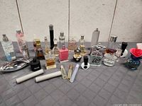 Overall view showing full assortment of perfume bottles, atomizers, samples and tray