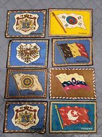 Eight cigar felts laid out showing all designs