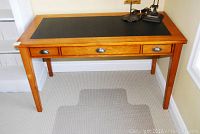 Full front view of desk showing three drawers and overall structure