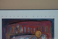 Close-up of artist name Heather Haynes on print showing colorful abstract artwork