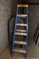 Full view of the Featherlite fiberglass step ladder showing blue frame and aluminum steps.
