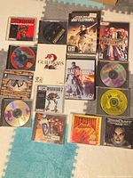 Overview of 15 PC games laid out on floor