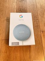 Front of retail box showing Google Nest Mini image and branding