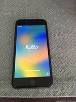 Front view powered on showing 'Hello' setup screen