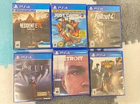 Six PS4 game cases front covers