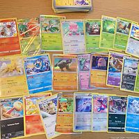 Overview of spread showing multiple holographic and standard Pokémon cards