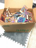 Box filled with loose Yu-Gi-Oh! cards