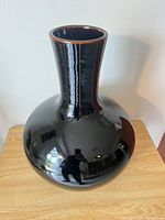 Full view of vase showing bottle form and gloss finish