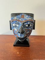 Front view of obsidian mask with blue lapis mosaic