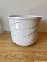 Side view of white swirl Scheurich planter