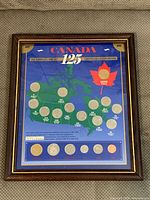 Full view of framed Canada 125 coin set