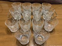 Full set of 14 tumblers arranged in rack on table
