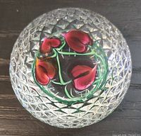 Top view showing pink and green floral cane within clear glass and honeycomb texture