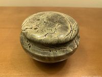 closed stone trinket box showing lid and exterior veining