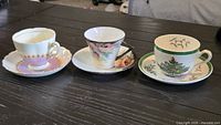 Three cup and saucer sets side by side
