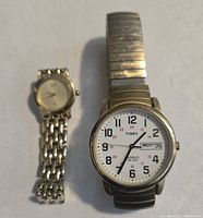 Both watches side by side showing overall lot contents