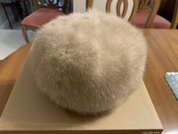 Top view of beige mink fur pillbox hat