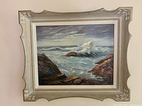 Full framed painting on wall showing seascape scene