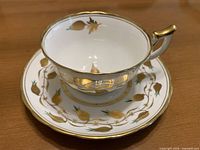 Teacup on saucer, front angle showing pattern