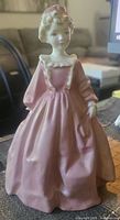 Front view of Royal Worcester Grandmother's Dress figurine showing dress colour and details