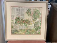 Full view of framed, matted floral garden print in silver frame