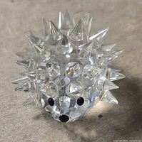 Front view clear crystal hedgehog figurine showing spikes, eyes and nose