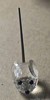 Front view of faceted crystal mouse with coil holder