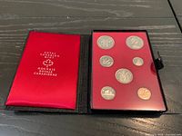 Closed presentation case and open view showing coin panel
