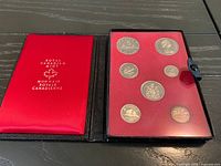 Closed view of case interior, coins visible in holder