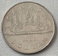 Reverse showing Voyageur canoe design with date 1986 and denomination