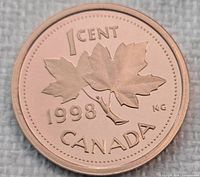 Reverse side showing maple leaves, denomination and year