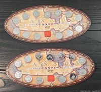 Both sides of the 1999 Canada Millennium quarter set shown in original oval map display holders