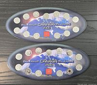 Two oval display cards each holding twelve 2000 Canadian Millennium 25-cent coins