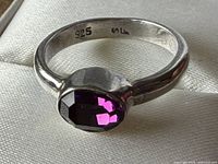 Ring profile showing 925 hallmark and gemstone setting