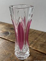 Full view of clear and pink crystal bud vase showing faceted sides and square rim