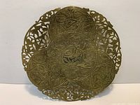 Front view of brass pierced filigree wall plate