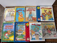 All eight Arthur books laid out
