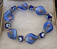 Overall view of the blue glass evil eye stretch bracelet