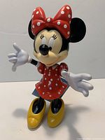 Front view of Minnie Mouse figurine standing upright