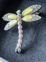 Full view of dragonfly brooch in box