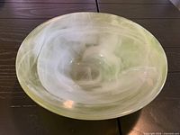 Top view showing green and white swirled interior of bowl