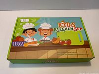 Front of sealed Kids Kitchen Set box showing graphics and age 3+