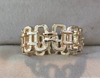 Front view of gold-tone link chain ring