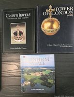 Front covers of the three books laid out on table