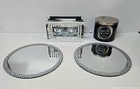 Group shot showing two mirrored trays, rhinestone votive holder, and Party Dress candle