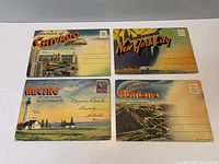 Fronts of all four postcard folders
